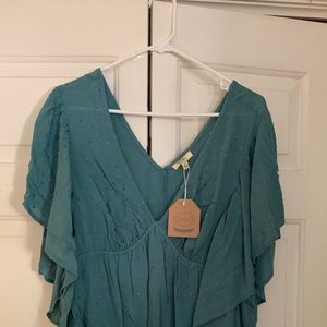 Teal blouse.